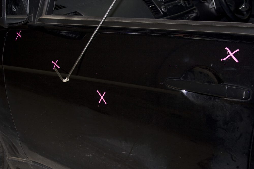 Marked-up dents before the repair